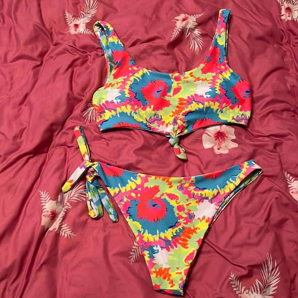 Gorgeous neon colored two piece bathing suit in tune with seasonal styles!